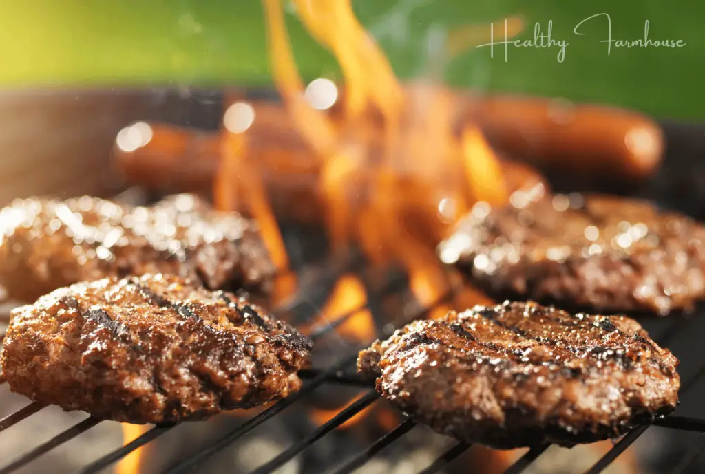 Burgers and hot dogs on the grill.