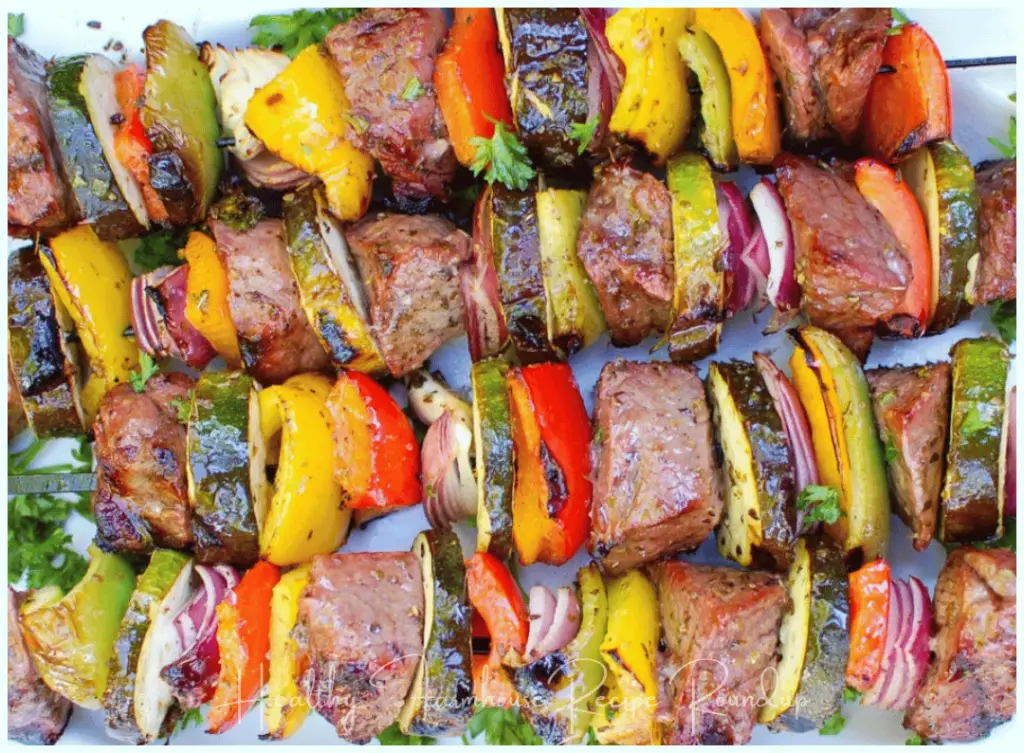 Healthy Grilling Recipe: steak kabobs with zucchini, red onion, and peppers.