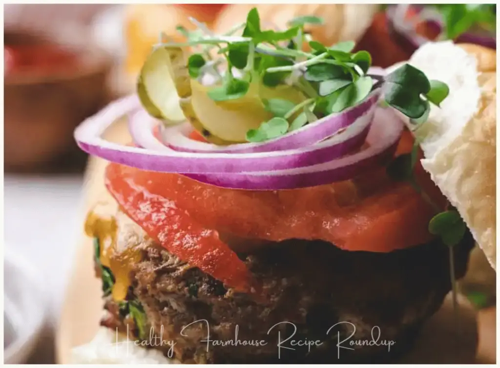 Basil turkey burger recipe stacked with toppings and microgreens
