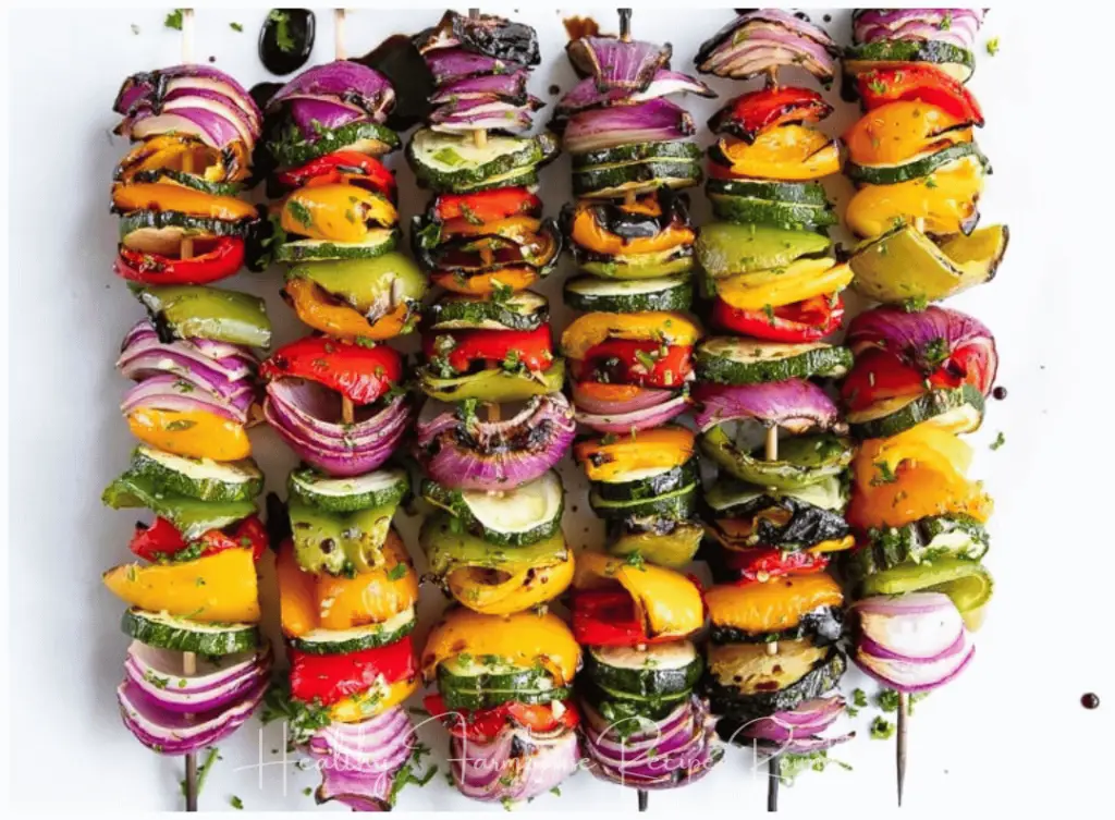 Grilled vegetable skewers with peppers, onions, and zucchini.