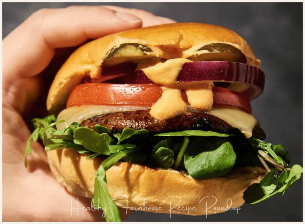 Portobello mushroom burger with toppings and dripping sauce