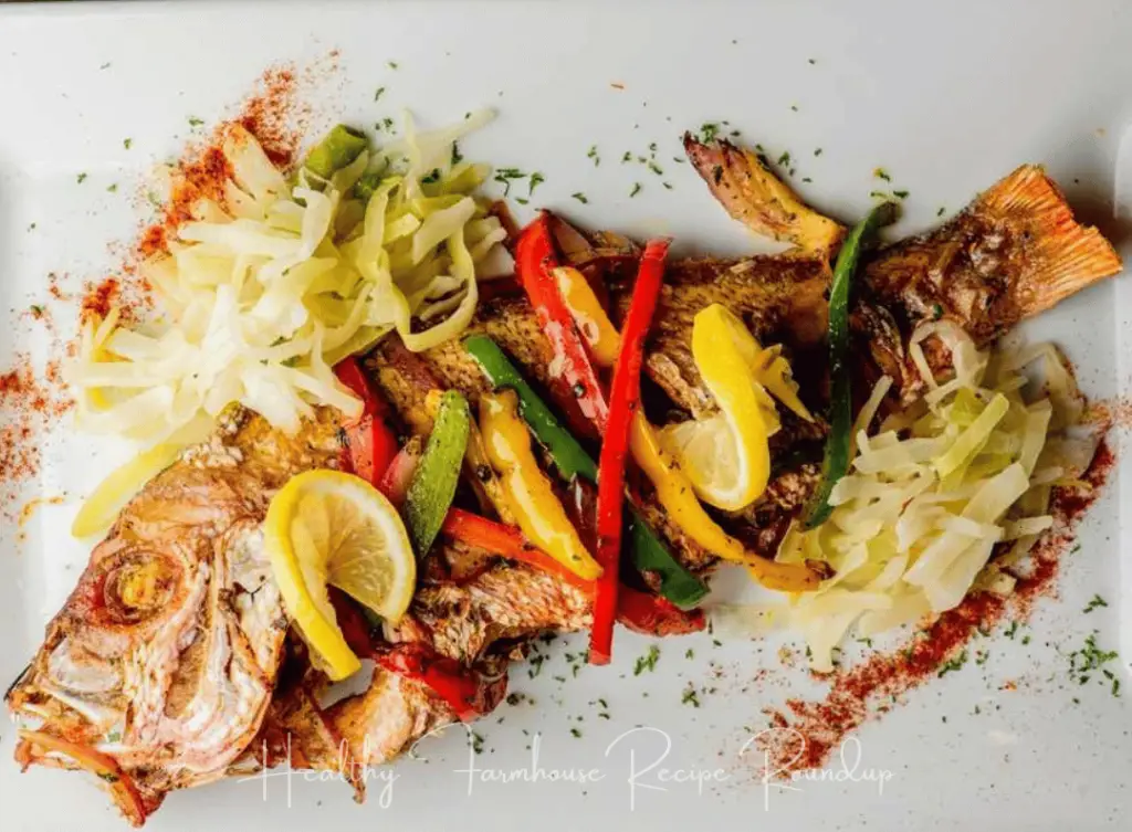 Grilled fish topped lemon and peppers