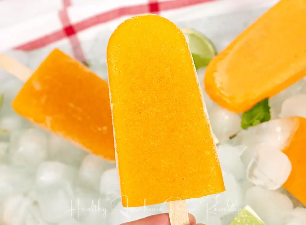 Frosty orange mango popsicle