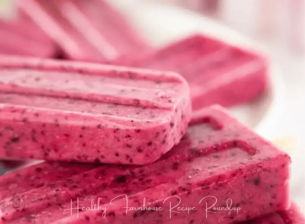 Speckled pink fruit and yogurt popsicle recipe