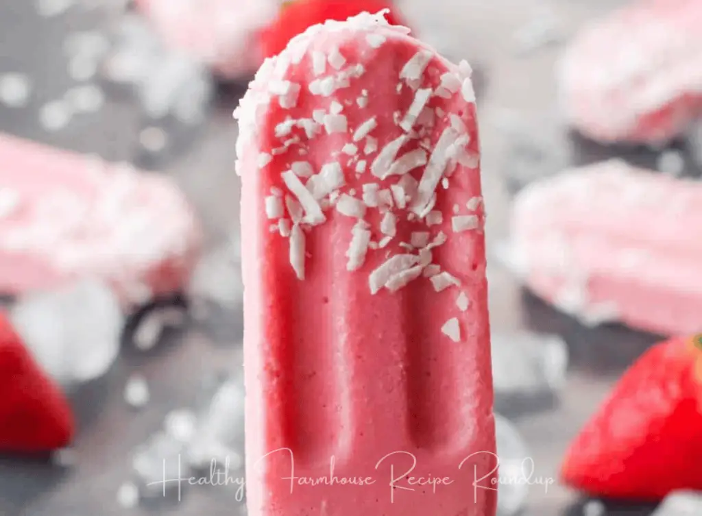 Light pink strawberry popsicle recipes using coconut shreds on top