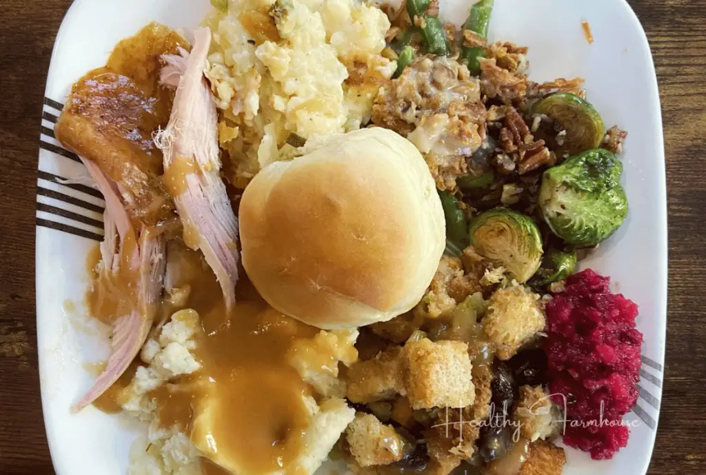 Perfect fall (Thanksgiving) dinner plate. Square plate with turkey, gravy, sides, and topped with a fresh roll.