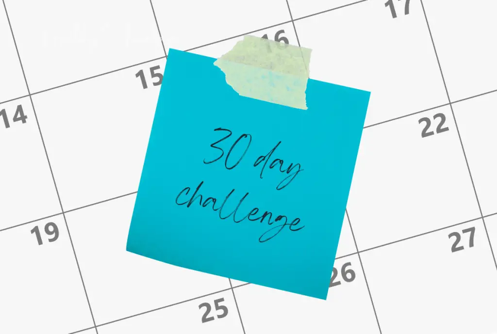 White calendar with bright blue sticky note that reads: 30 Day Workout Challenges