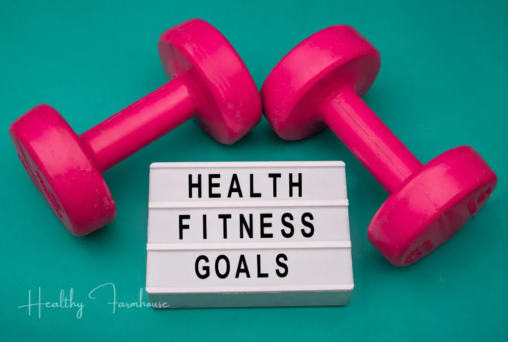 Bright blue background with pink hand weights with text that reads: Health Fitness Goals