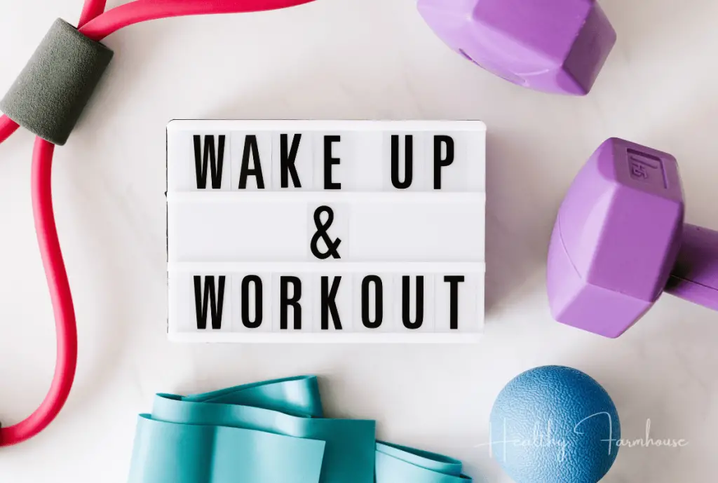 White background with purple hand weights and black text that reads: Wake up and Workout!