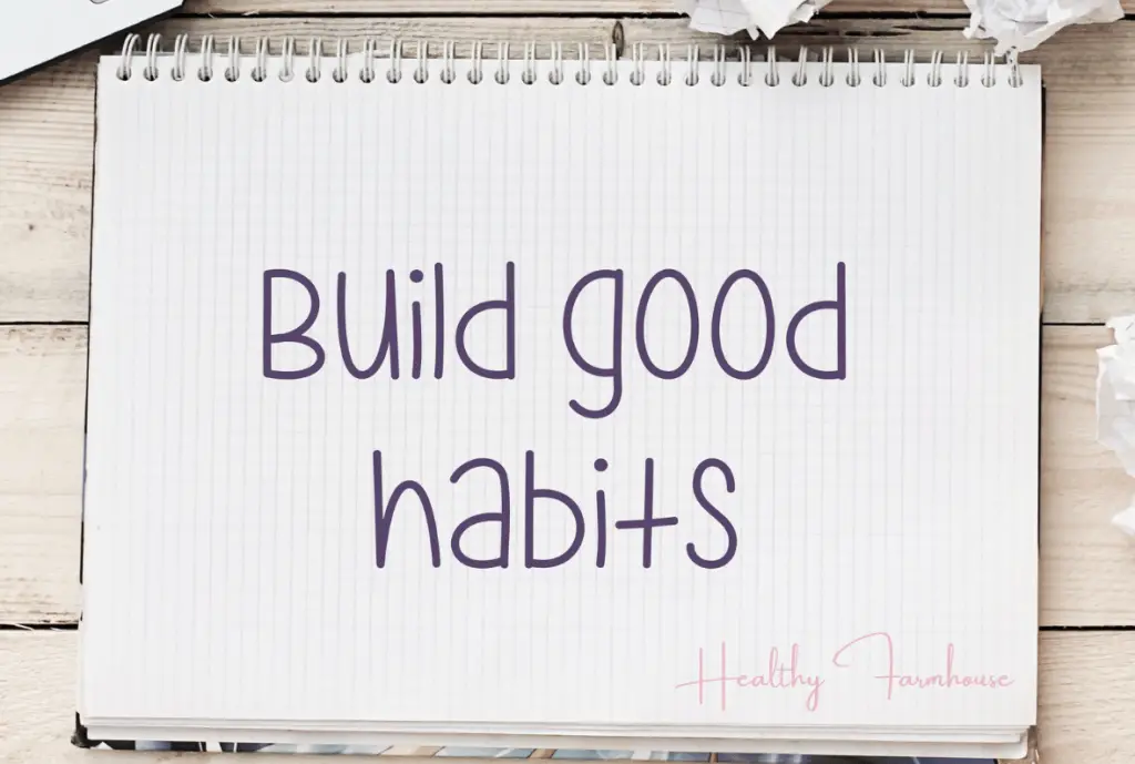 White notebook page that reads: Build Good habits for working out throughout the day