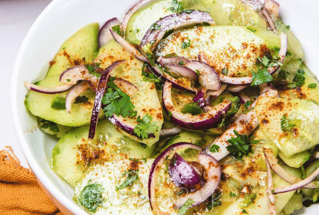 Mexican cucumber salad placed in a white dish