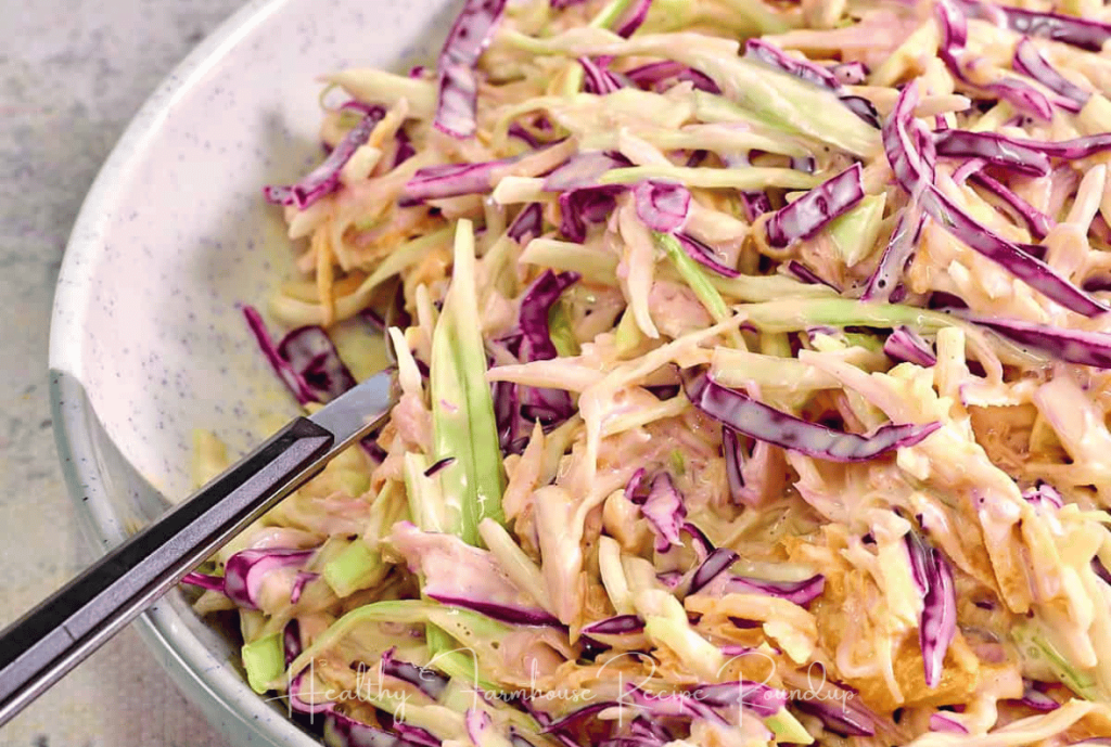 Traditional coleslaw recipe with shredded cabbage in a white bowl